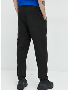 Bavlnené tepláky Tommy Jeans pánske, čierna farba, jednofarebné
