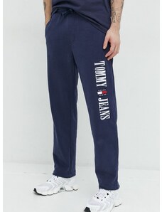 Bavlnené tepláky Tommy Jeans pánske, tmavomodrá farba, s nášivkou