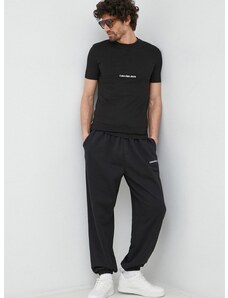 Tepláky Calvin Klein Jeans čierna farba, s nášivkou