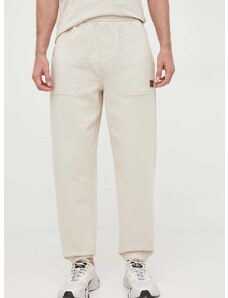 Bavlnené tepláky Calvin Klein Jeans béžová farba, jednofarebné