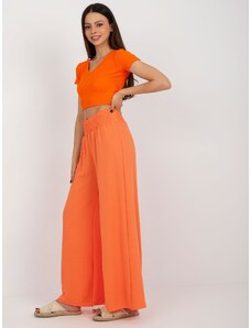 ITALY MODA Oranžové dámske nohavice zo vzdušnej látky so širokými nohavicami na gumičku