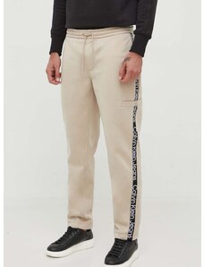 Tepláky Calvin Klein Jeans béžová farba, s nášivkou