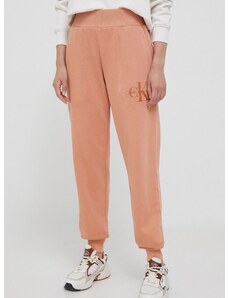 Bavlnené tepláky Calvin Klein Jeans oranžová farba, jednofarebné