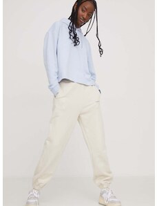 Bavlnené tepláky Tommy Jeans béžová farba,s nášivkou,DW0DW17309