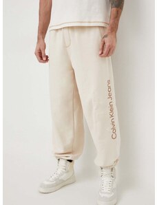 Bavlnené tepláky Calvin Klein Jeans béžová farba,s nášivkou,J30J324953