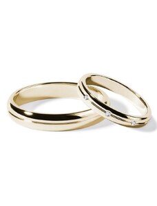 Súprava svadobných obrúčok zo žltého zlata s drážkou a diamantmi KLENOTA S0904103