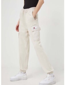 Tepláky Tommy Jeans béžová farba, jednofarebné, DW0DW17313