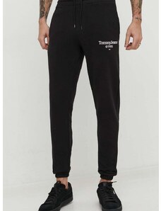 Bavlnené tepláky Tommy Jeans čierna farba,s potlačou,DM0DM18935