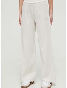 Bavlnené nohavice Karl Kani béžová farba, široké, vysoký pás