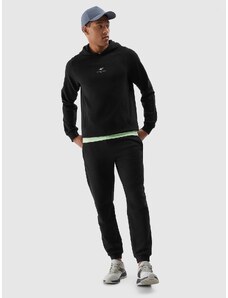 4F Pánske teplákové nohavice typu jogger z organickej bavlny - čierne