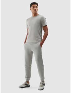 4F Pánske teplákové nohavice typu jogger z organickej bavlny - šedé
