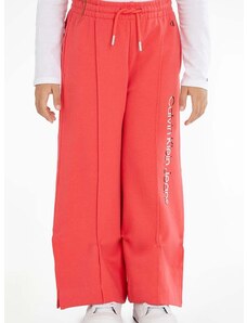 Detské bavlnené tepláky Calvin Klein Jeans červená farba, s potlačou