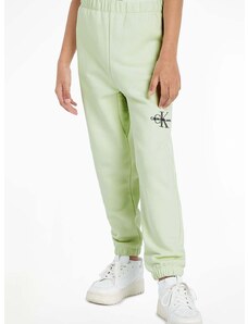 Detské tepláky Calvin Klein Jeans zelená farba, jednofarebné