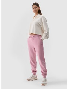 4F Dámske teplákové nohavice typu jogger - púdrovo ružové