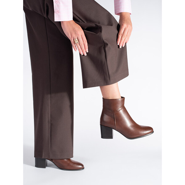 Brown ankle boots on a block by Sergio Leone 56647038