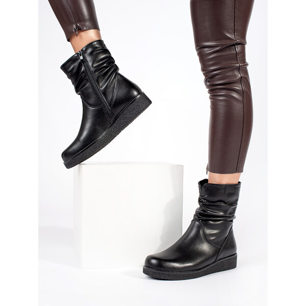 Womens black leather ankle boots on a low wedge with a crinkled upper 58314869