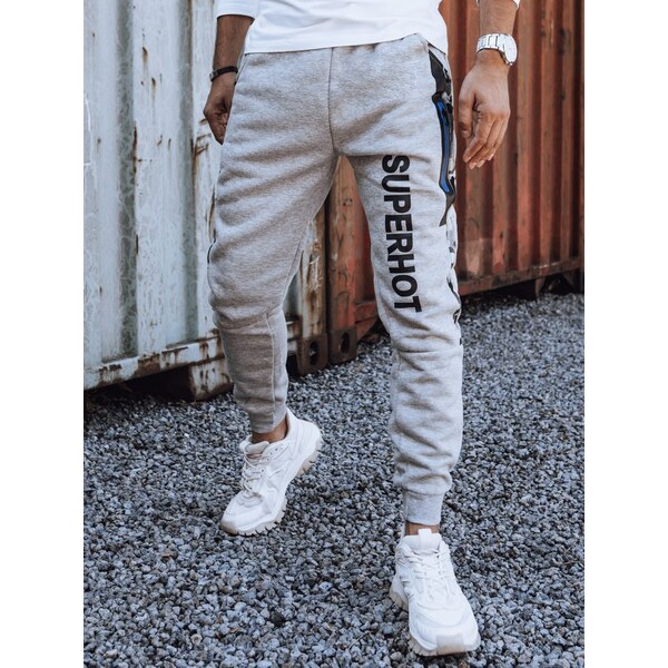 Dstreet Zaujímavé pánske tepláky s nápisom v sivej farbe 63302846