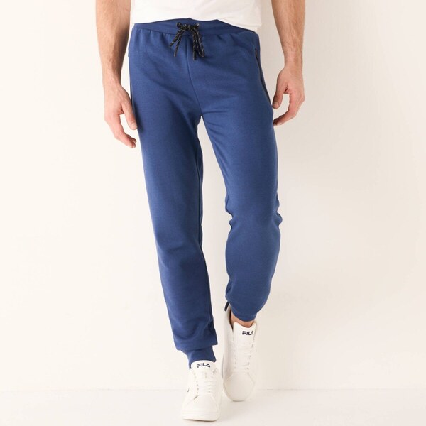 Športové nohavice so zúženými koncami a kontrastnými detailmi modrá 65325778