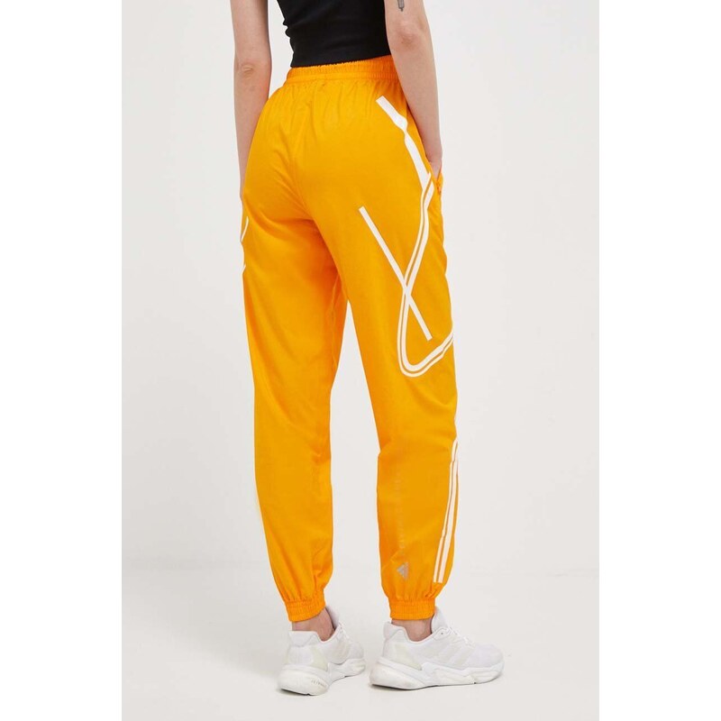 Tréningové nohavice adidas by Stella McCartney TruePace oranžová farba, s potlačou