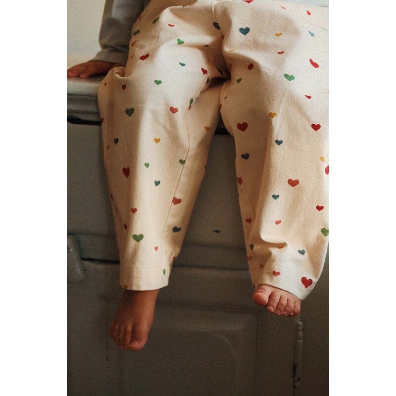 Detské bavlnené nohavice Konges Sløjd béžová farba, jednofarebné