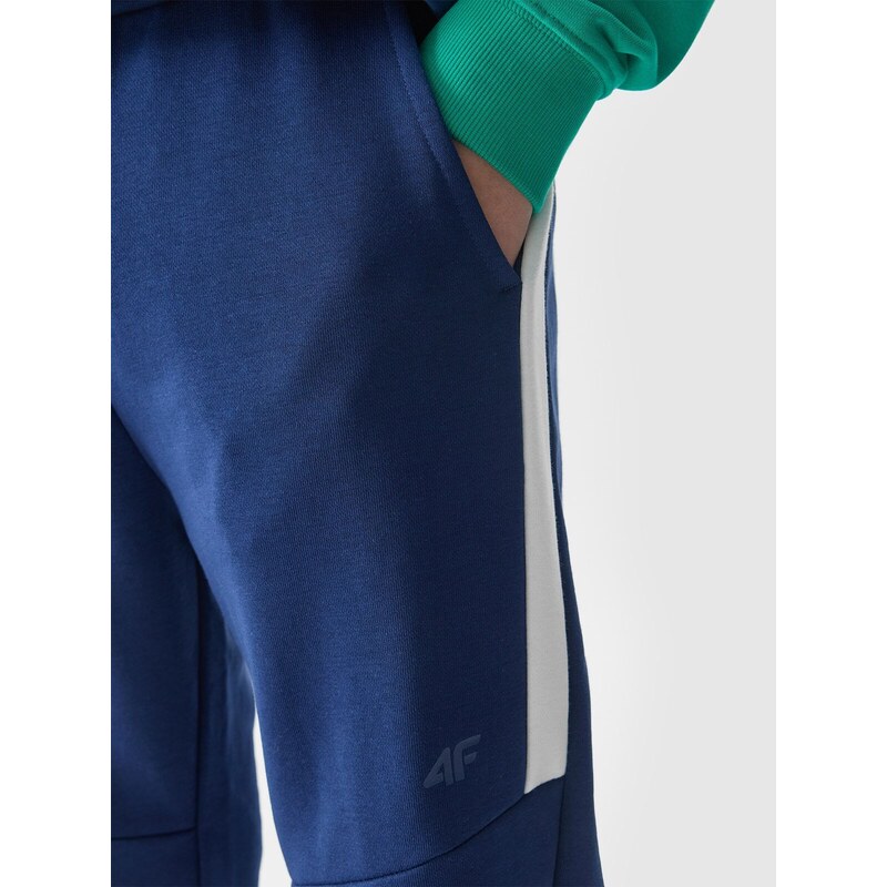 4F Chlapčenské teplákové nohavice typu jogger - námornícka modrá