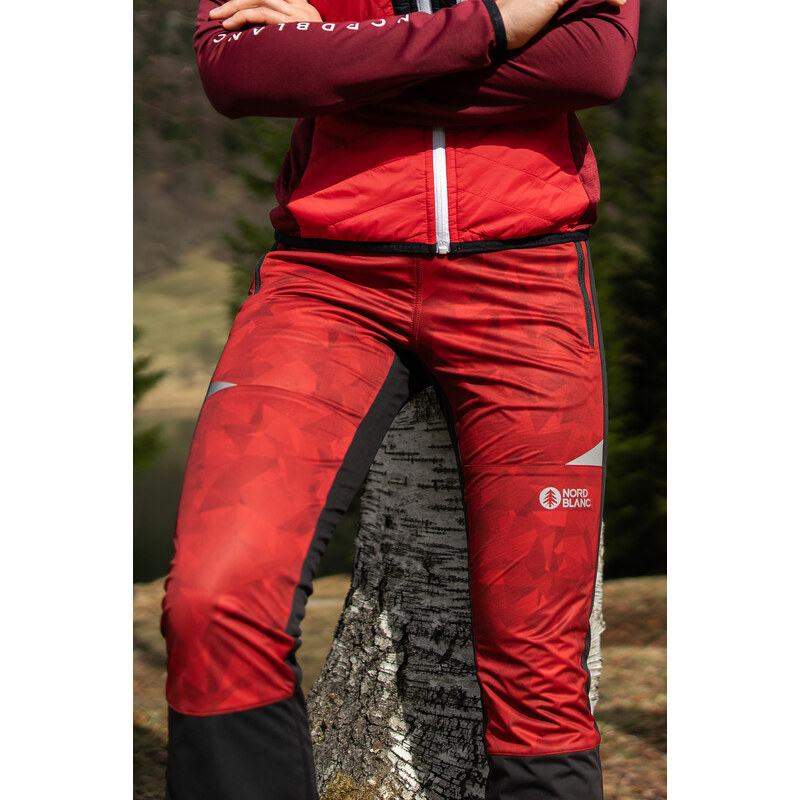 Nordblanc Červené dámske ľahké nepremokavé softshellové nohavice AESTHETIC