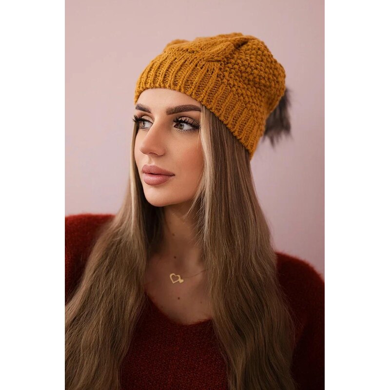 MladaModa Dámska čiapka s kožušinkovým brmbolcom K210 horčicová 36491730