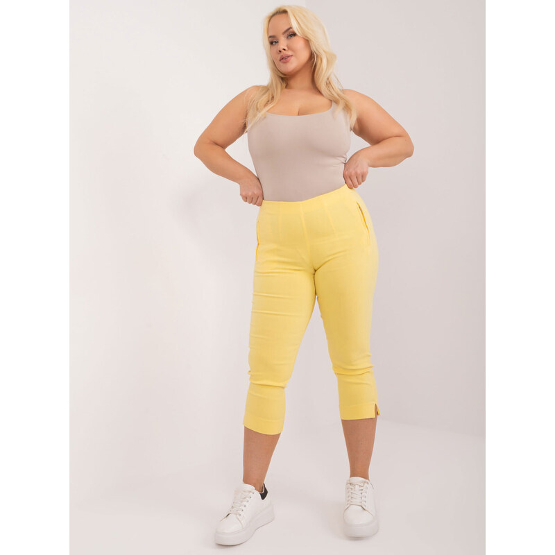(veľ. 46 a 50) Pružné capri nohavice s vreckami žlté 64124838