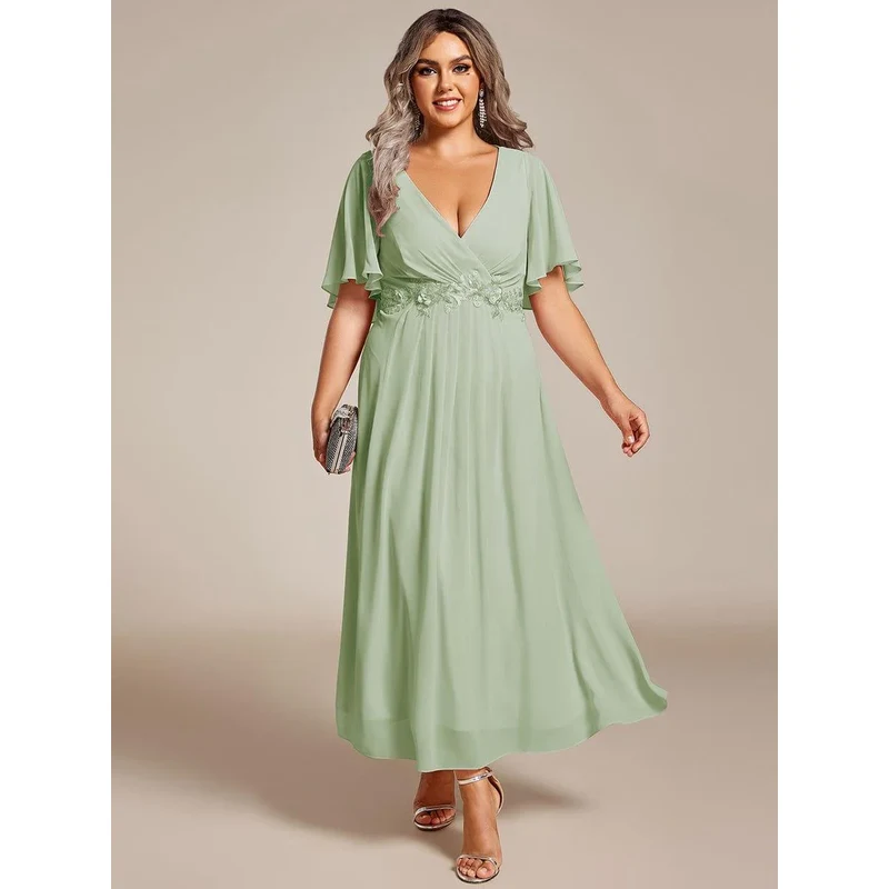 (veľ. 46) Midi šaty s ozdobou na páse bledozelené 64125015