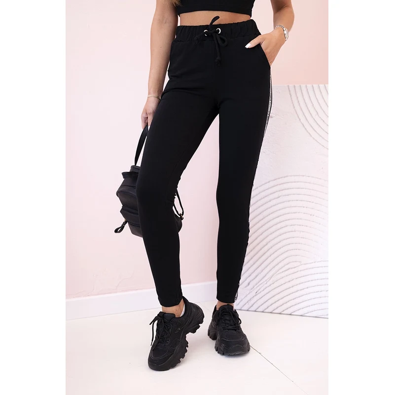 Kesi Dámske teplákové nohavice s lampasom a viazaním v páse čierne 64695452