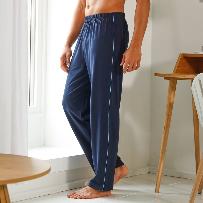 Jednofarebné pyžamové nohavice s kontrastným zakončením nám.modrá 038 61916476