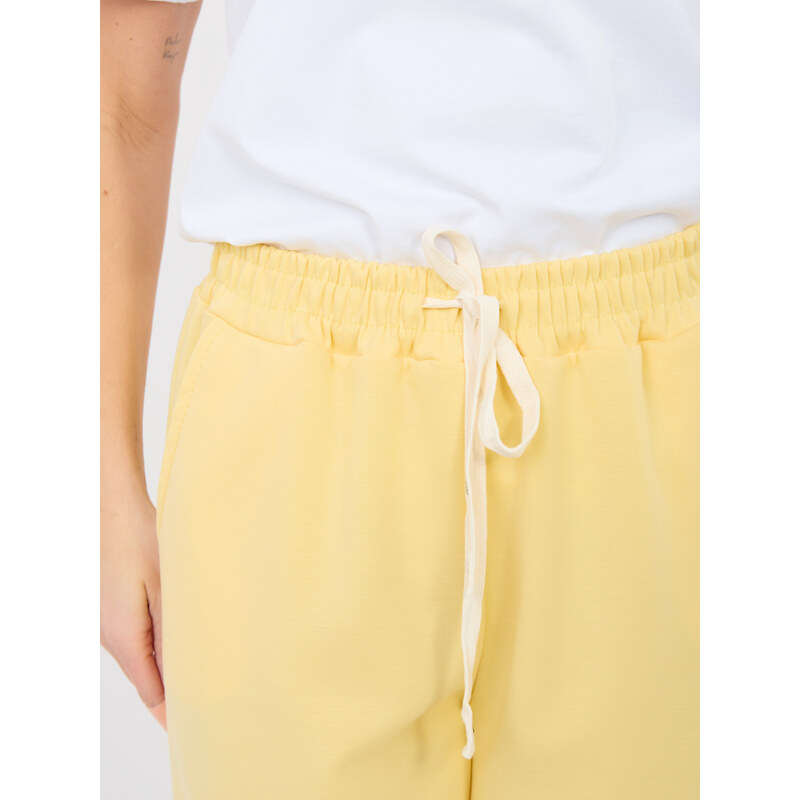 Italy Moda Svetložlté tepláky s viazaním 67313494