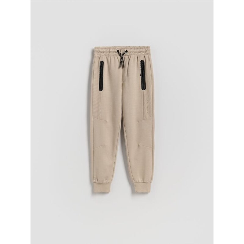 Reserved - Bavlnené jogger nohavice - béžová 68510625