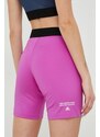 Športové krátke nohavice The North Face Mountain Athletics dámske, fialová farba, jednofarebné, stredne vysoký pás