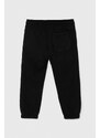 Detské tepláky Calvin Klein Jeans čierna farba, s potlačou