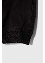 Detské bavlnené nohavice Guess čierna farba, jednofarebné