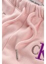 Detské tepláky Calvin Klein Jeans ružová farba, vzorované